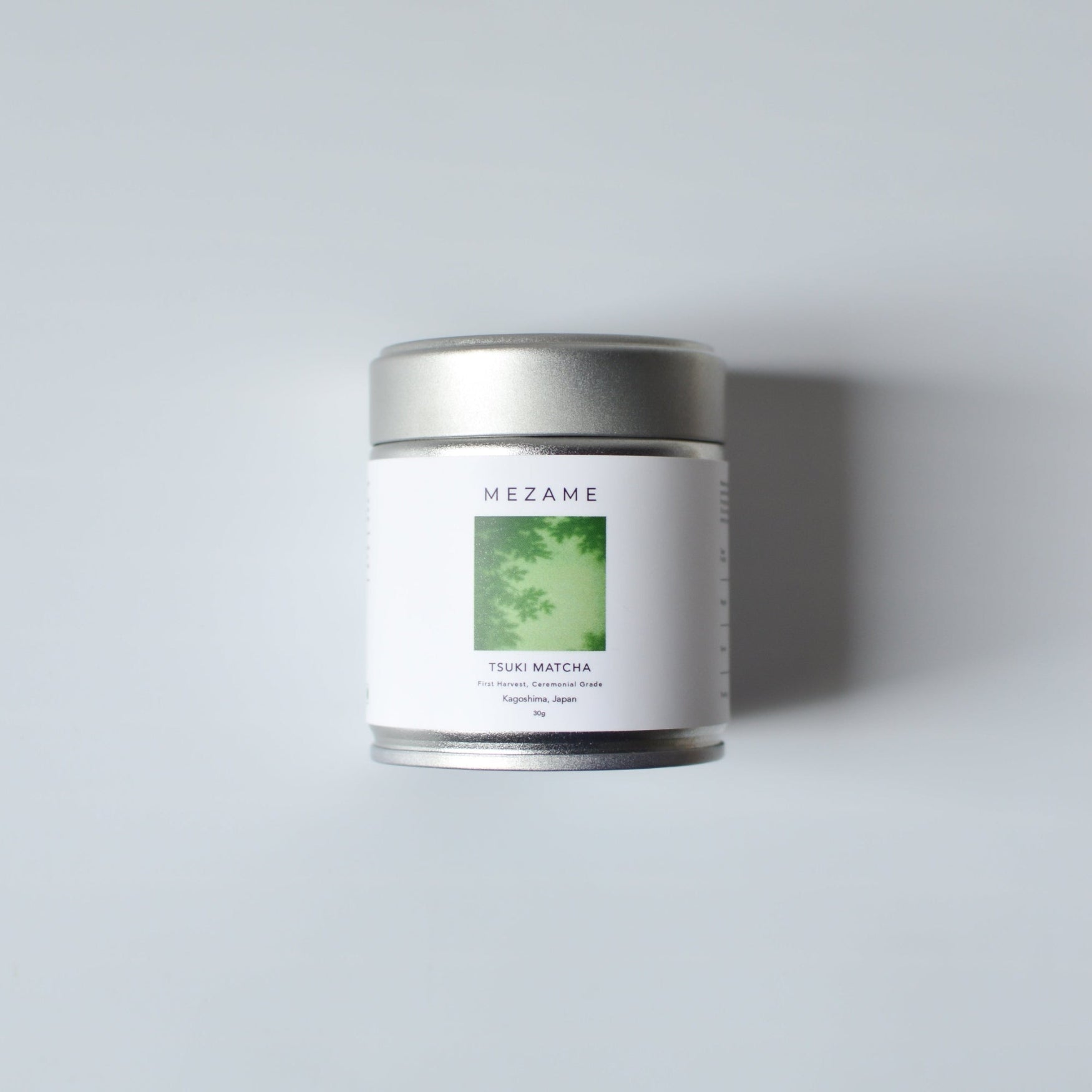 Mezame Silver matcha tin on a light gray background