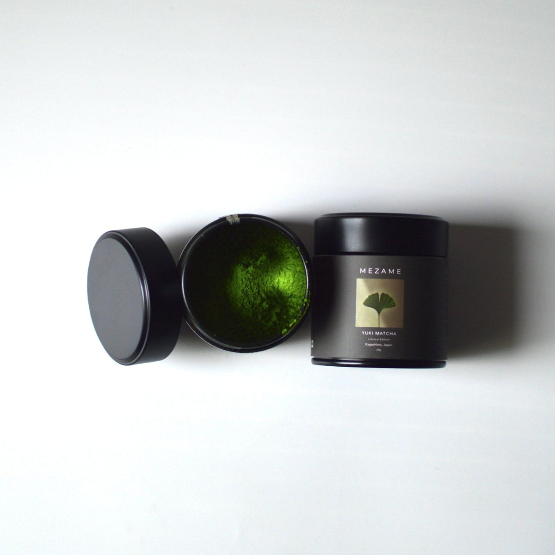 Mezame Yuki Matcha Tin with vibrant green matcha on a white background
