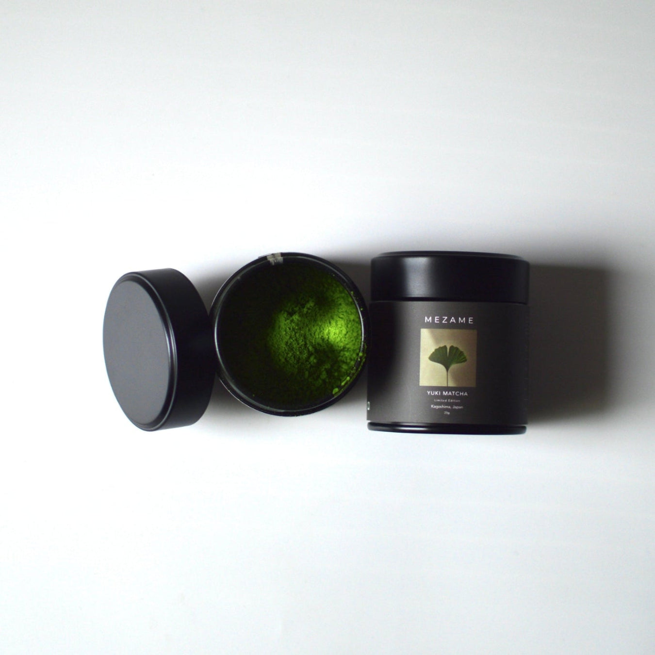 Mezame Yuki Matcha Tin with vibrant green matcha on a white background