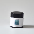 Small matcha tin with a black lid and white label on a light gray background